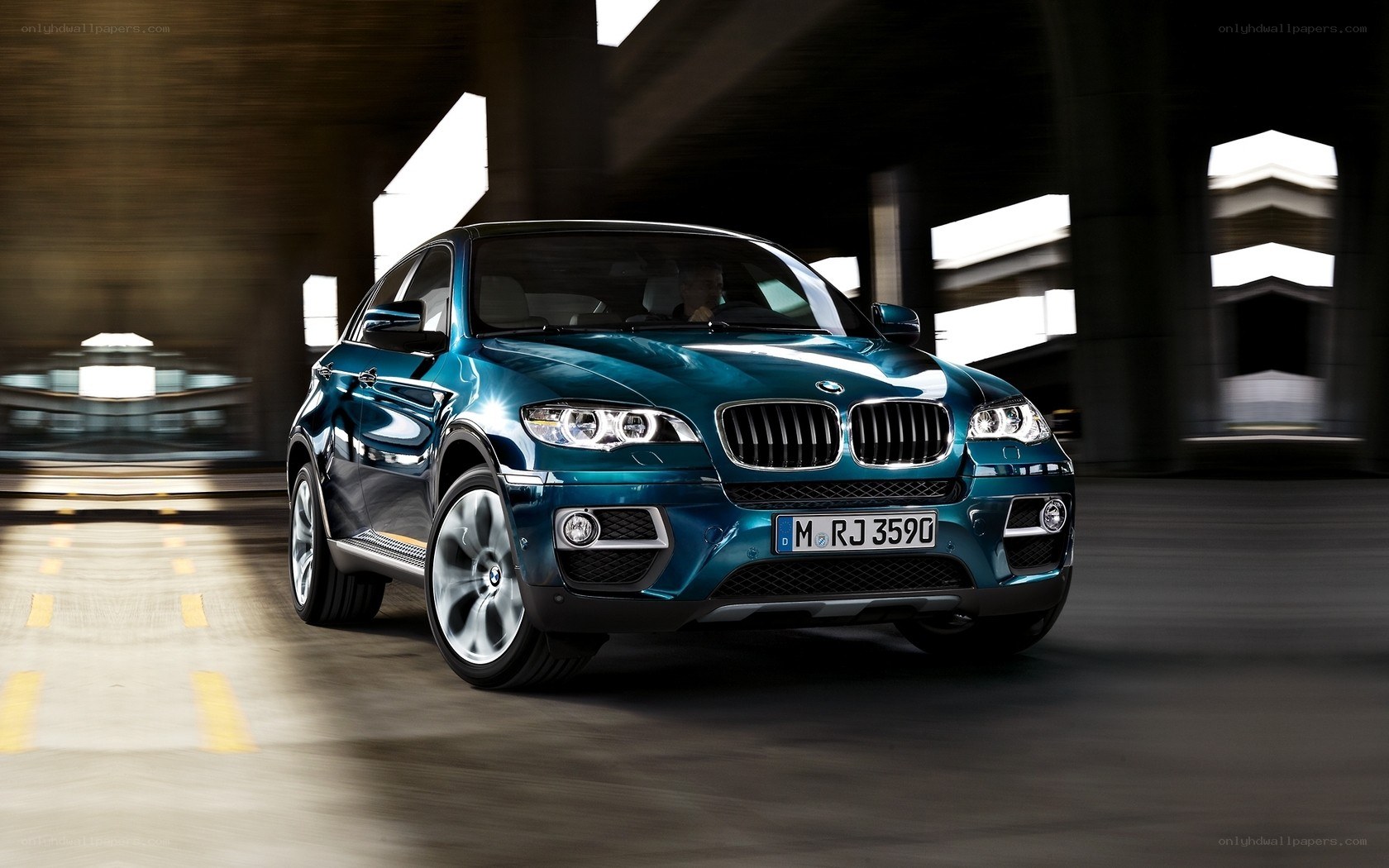 blue bmw x6 in motion