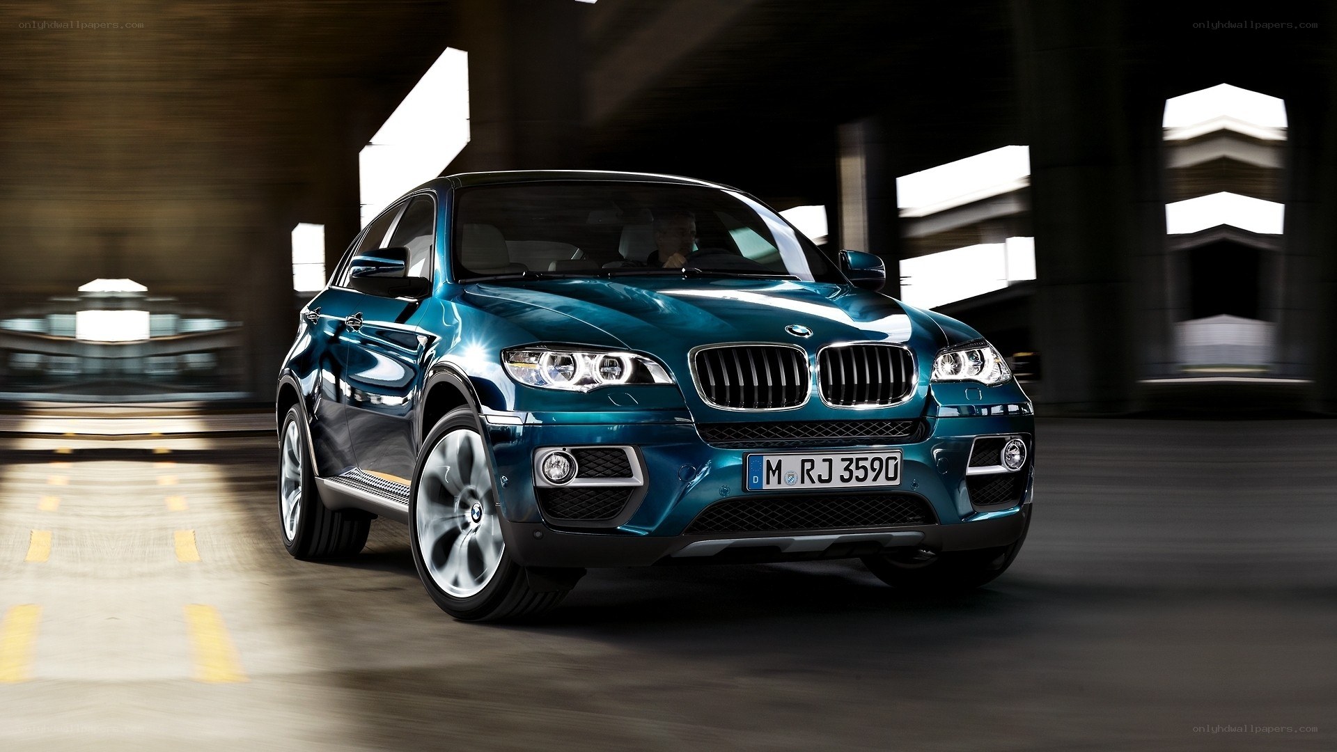 Blue BMW X6 in motion