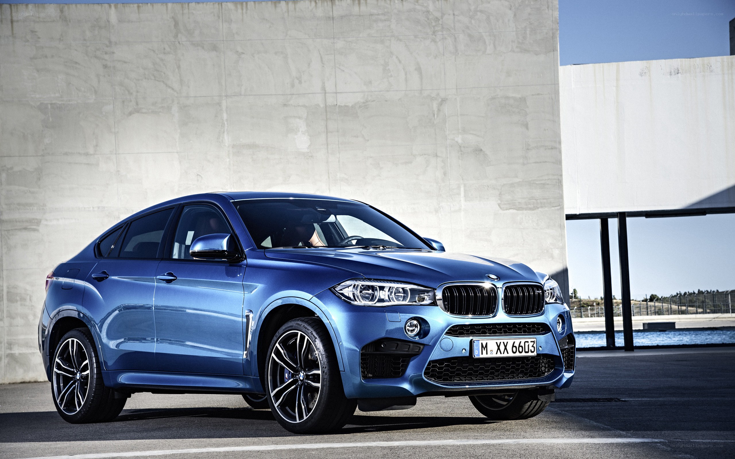 Blue BMW X6 M parked