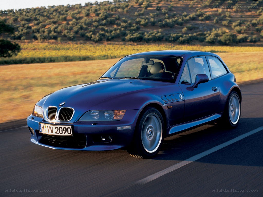 blue bmw z3 in motion