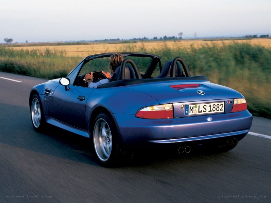 blue bmw z3 roadster driving