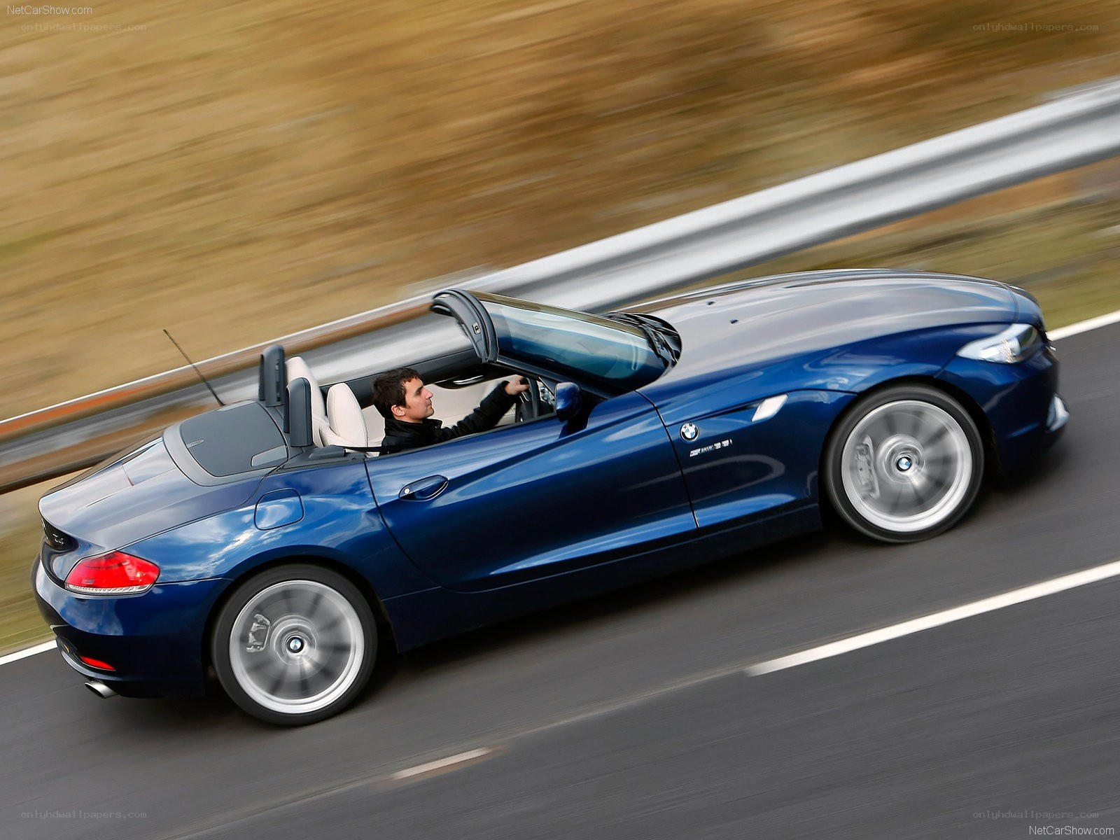Blue BMW Z4 convertible in motion