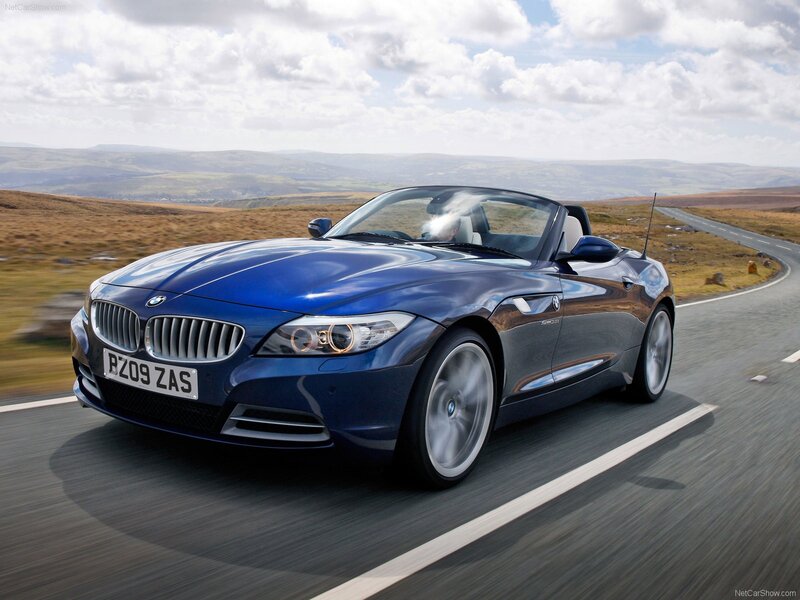 Blue BMW Z4 convertible on a road