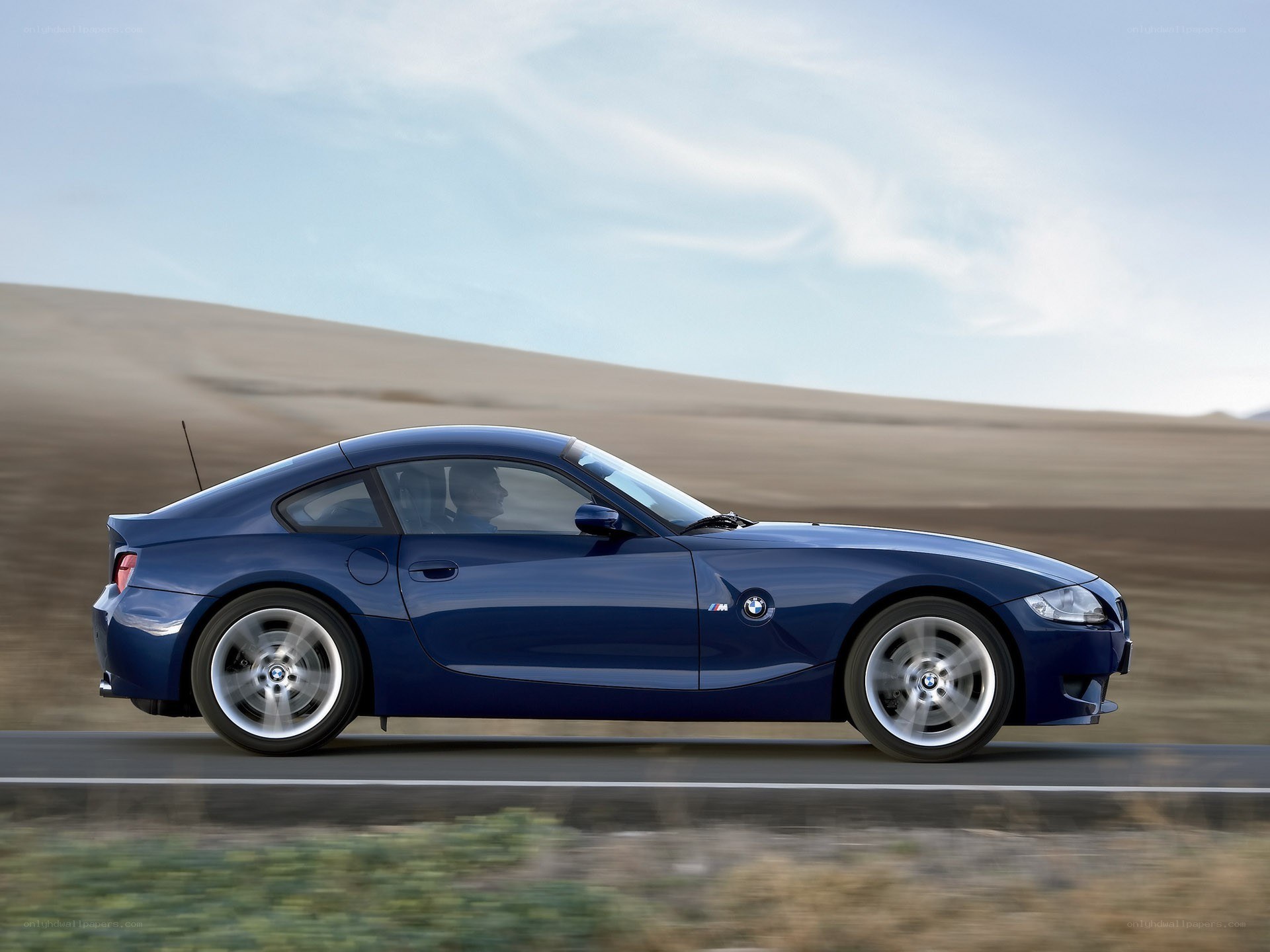 blue bmw z4 m in motion