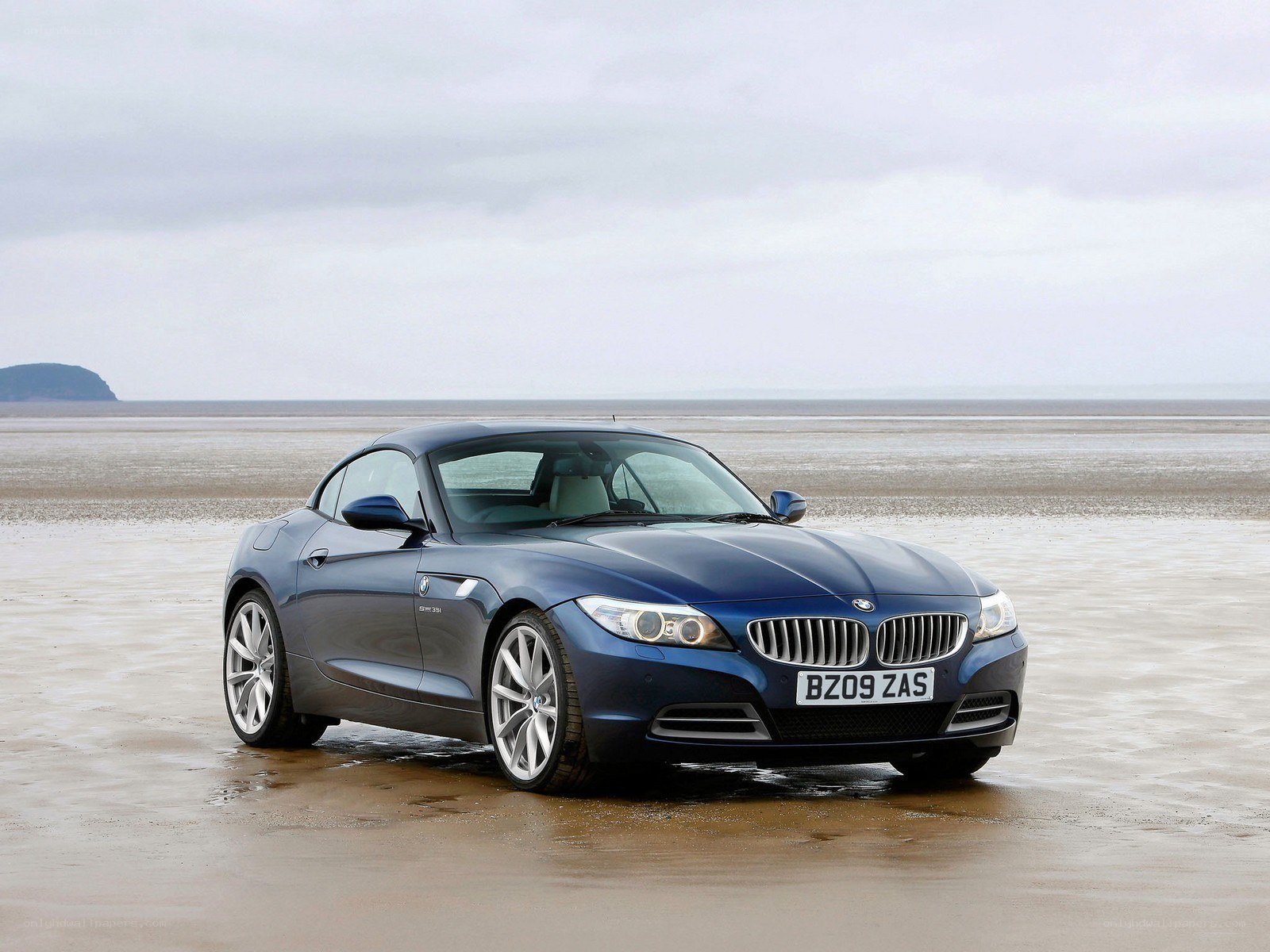 Blue BMW Z4 on a beach