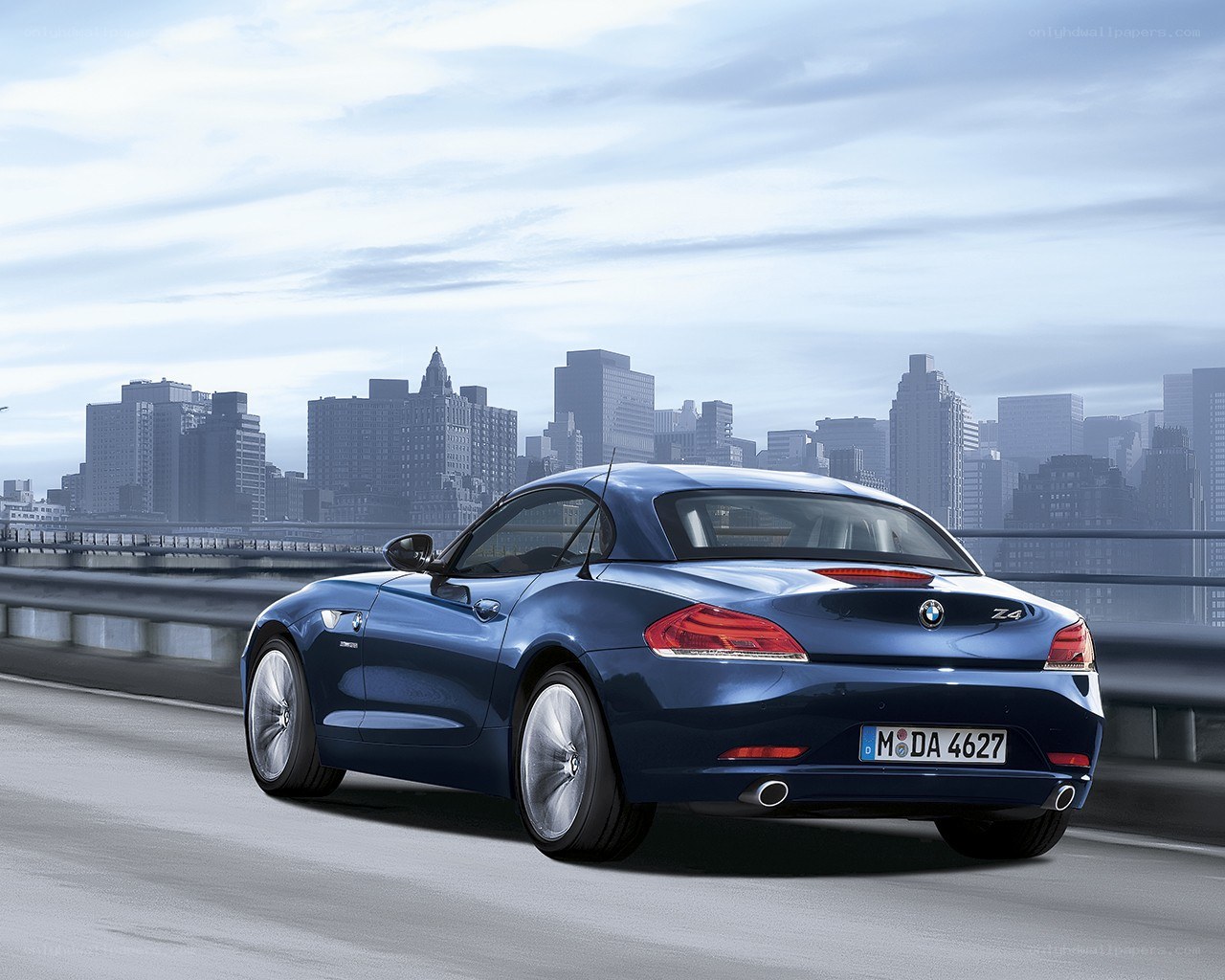 Blue BMW Z4 on city bridge