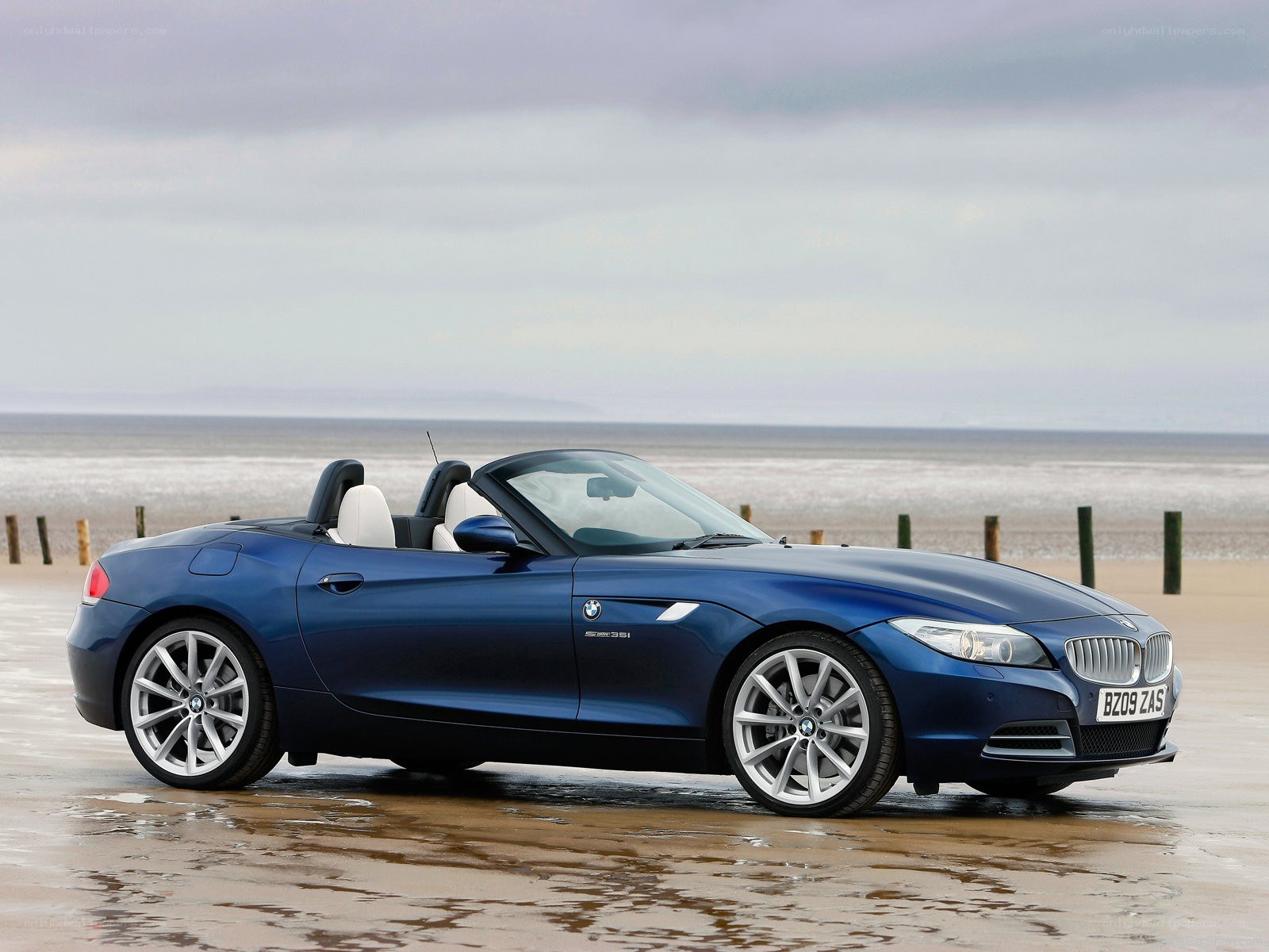Blue BMW Z4 on the beach