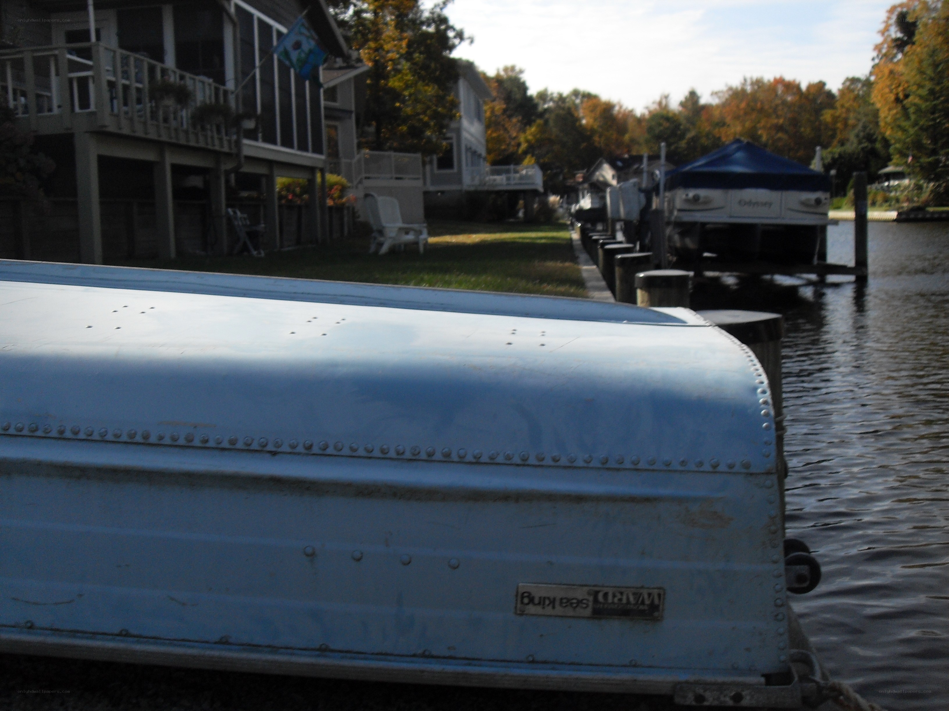 blue boat at a dock