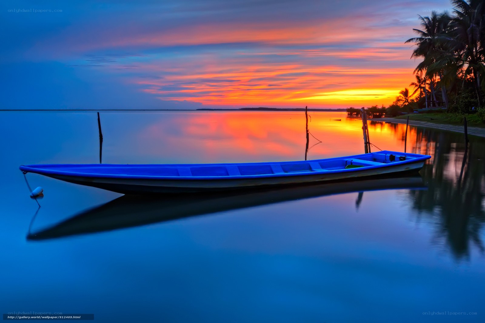 Blue boat at sunset