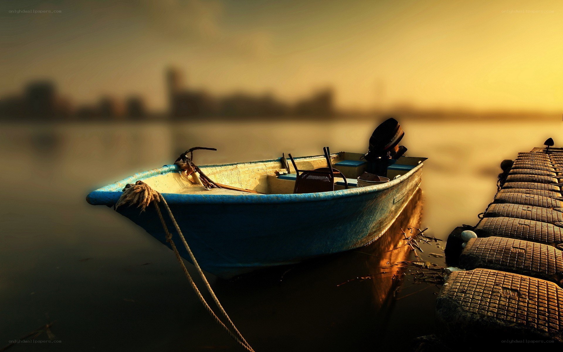 blue boat at sunset