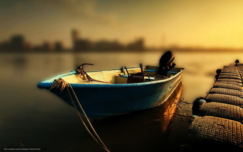 Blue boat at sunset