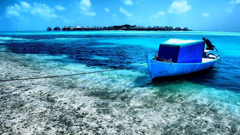 Blue boat at tropical resort