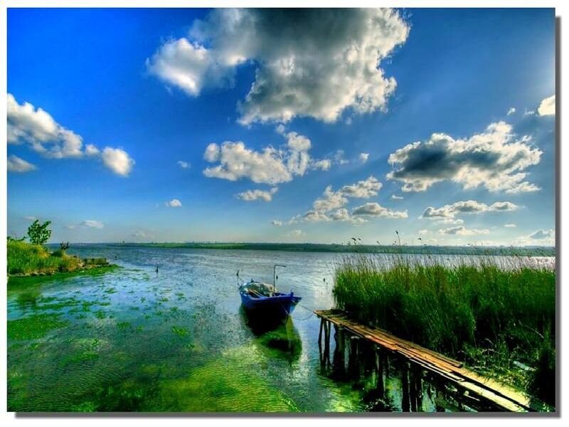 Blue boat on a calm lake