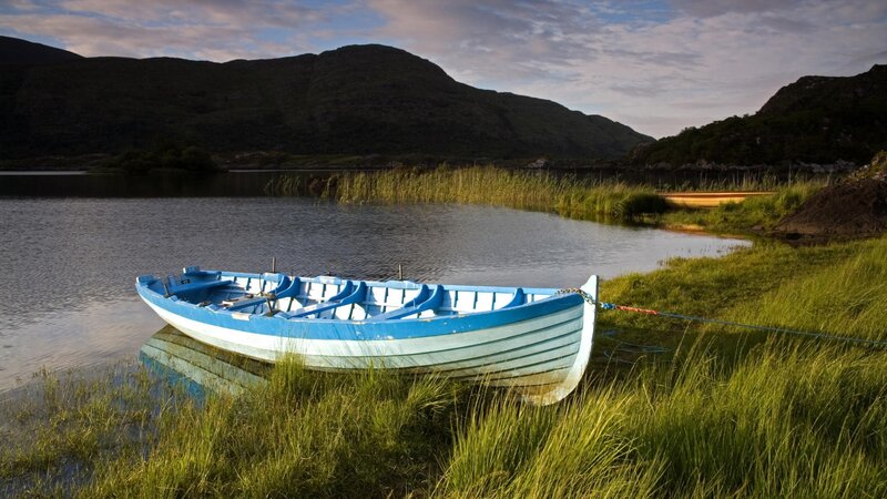 Blue boat on a calm lake