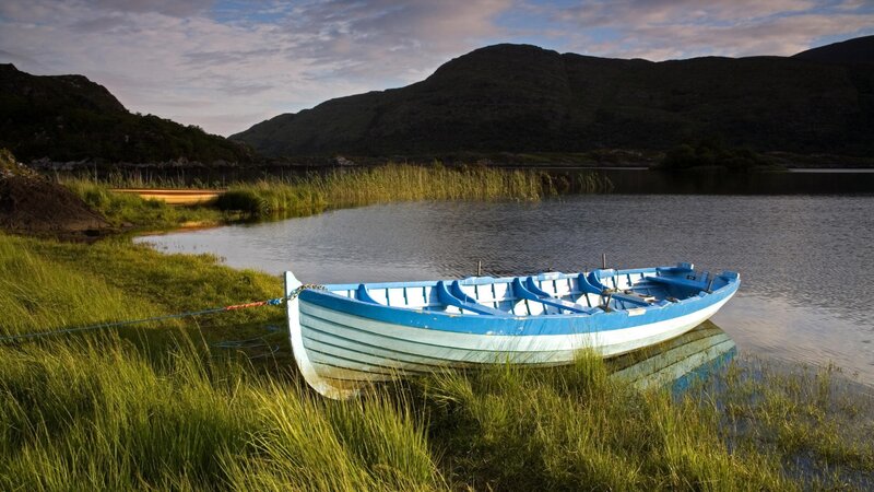 Blue boat on a calm lake
