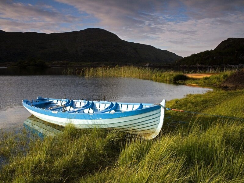 Blue boat on a calm lake