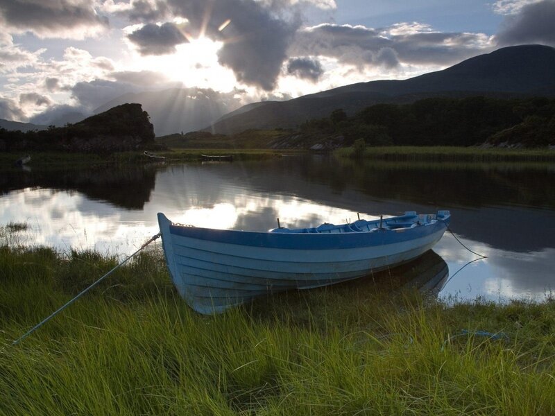 Blue boat on a calm lake