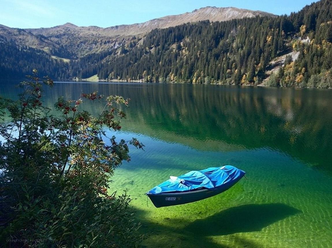 Blue boat on a clear lake