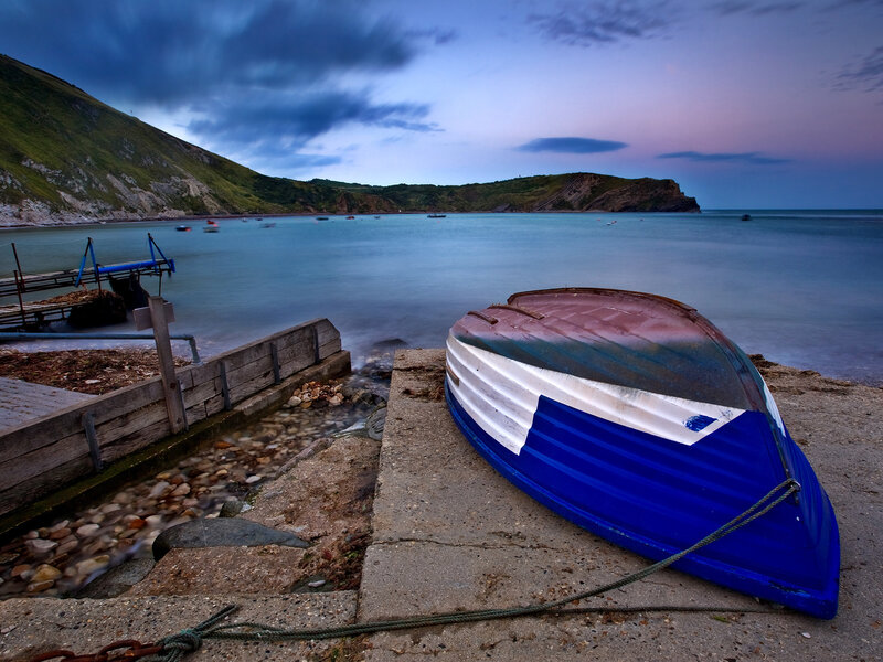 Blue boat on a coastal shore