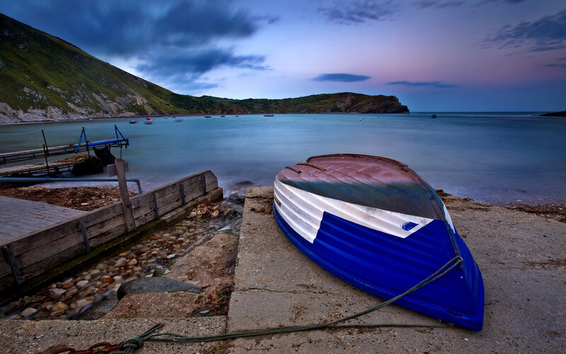 Blue boat on a coastal shore