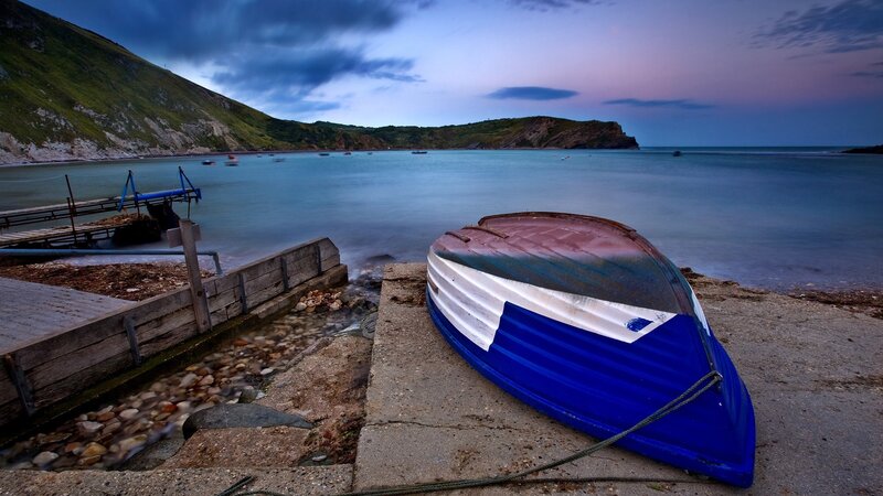 Blue boat on a coastal shore