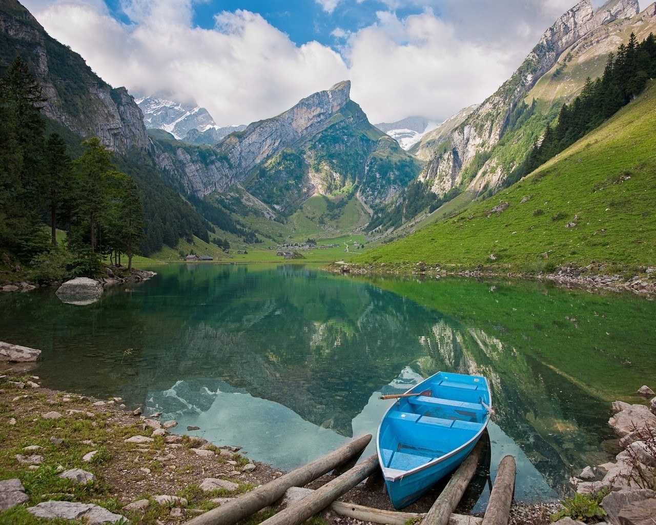 Blue boat on a mountain lake