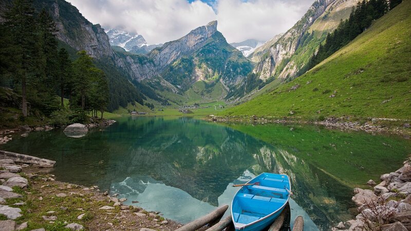 Blue boat on a mountain lake