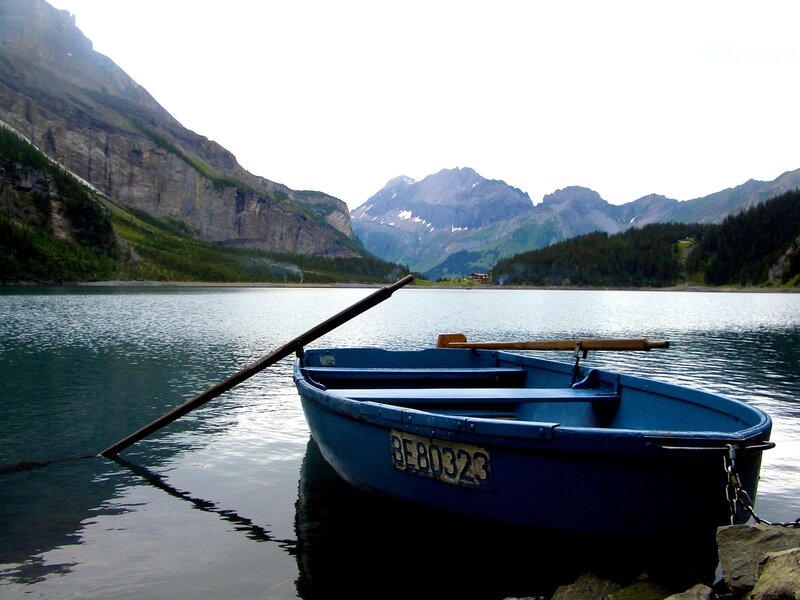 Blue boat on a mountain lake