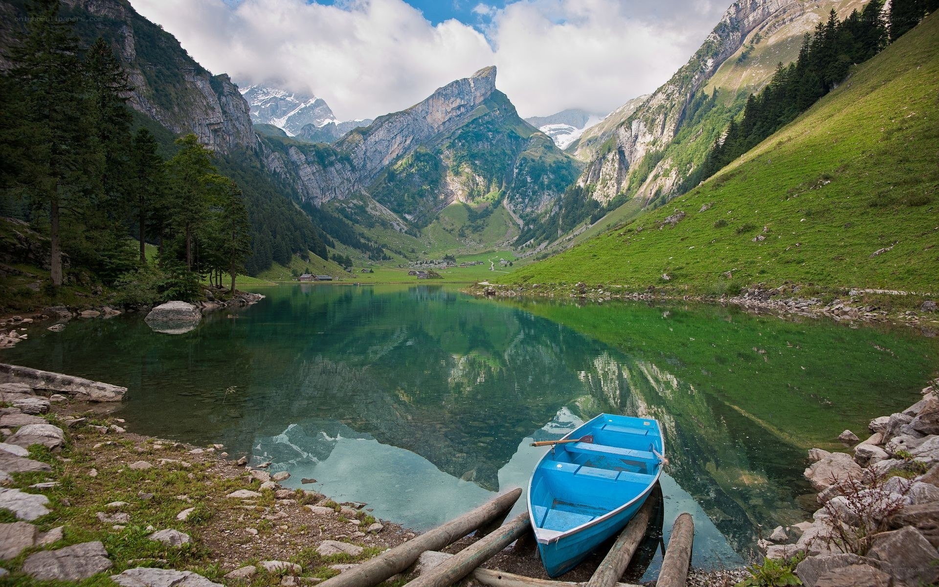 Blue boat on alpine lake