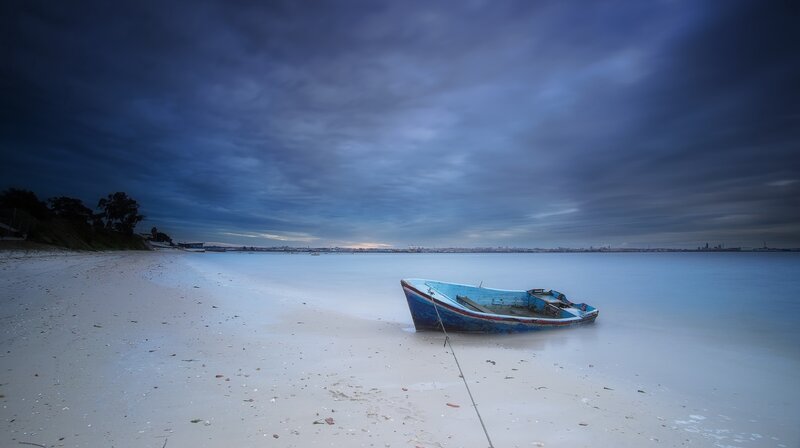 Blue Boat on Beach — Dramatic, Sunset, Photograph
