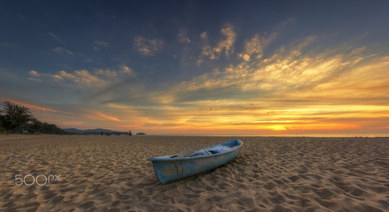 Blue Boat on Beach — Serene, Sunset