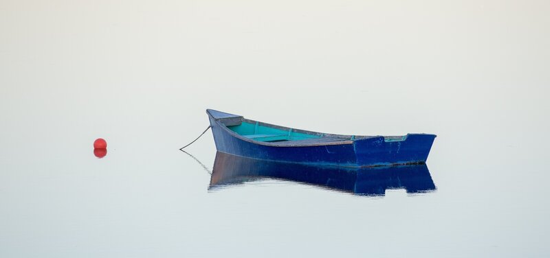 Blue Boat on Calm Water — Serene