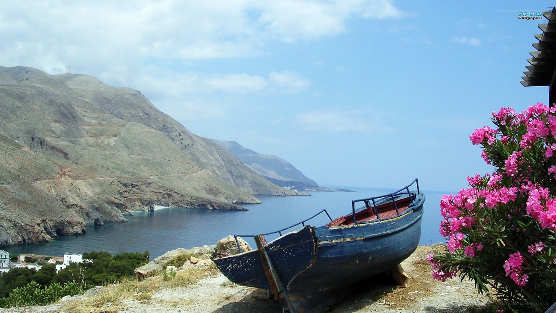 Blue boat on coastal hillside