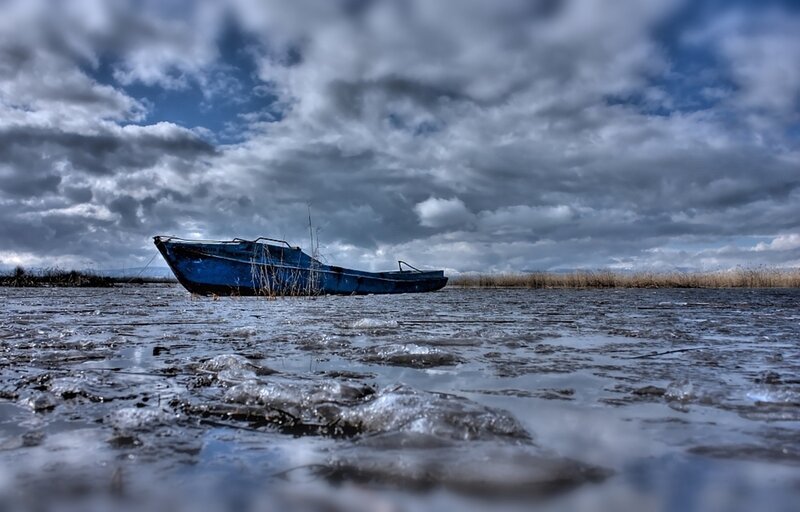 Blue Boat on Frozen Water