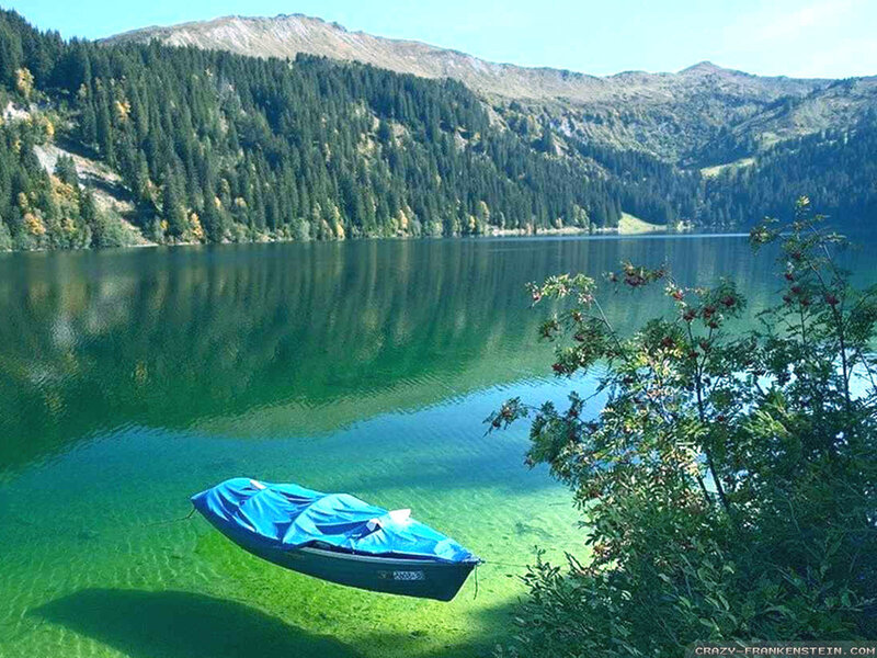 Blue Boat on Lake — Green, Serene, Afternoon, Photograph, Mountain