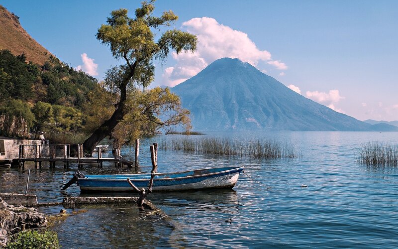 Blue Boat on Lake — Serene, Afternoon, Photograph, Mountain, Tree, Dock