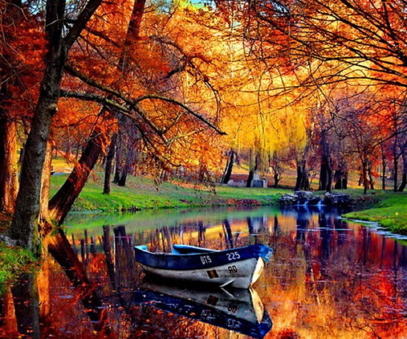 Blue Boat on River — Orange, Serene