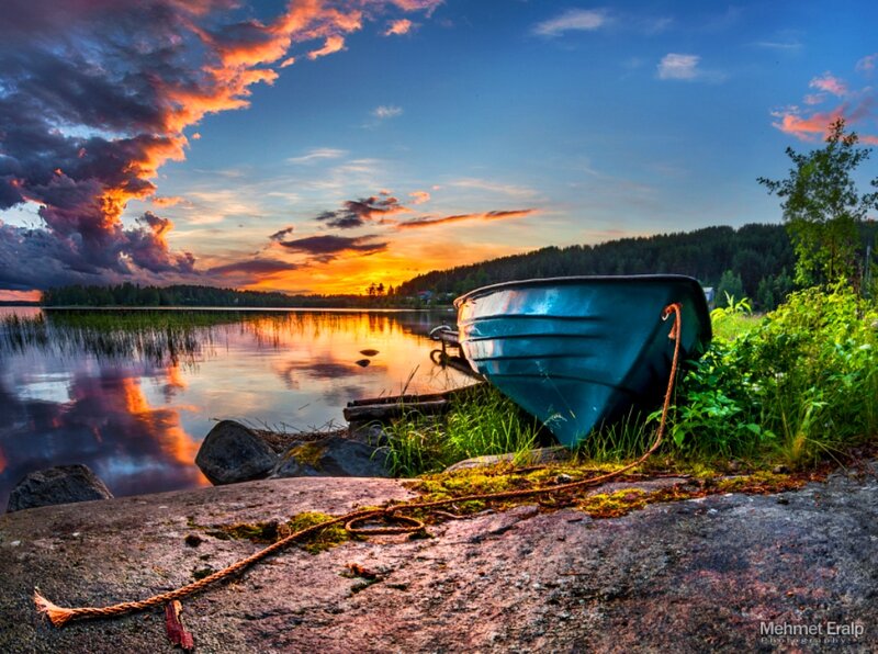 Blue Boat on Shore — Dramatic, Sunset, Photograph