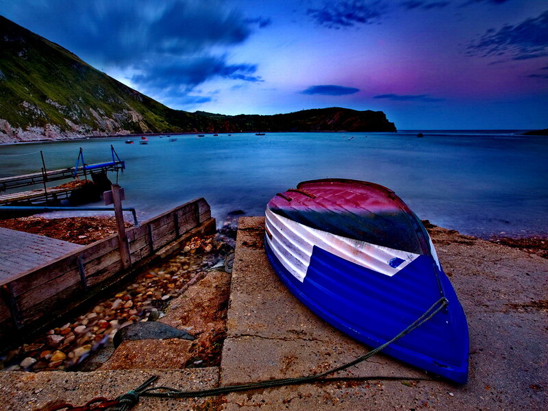 Blue Boat on Shore — Dramatic, Sunset