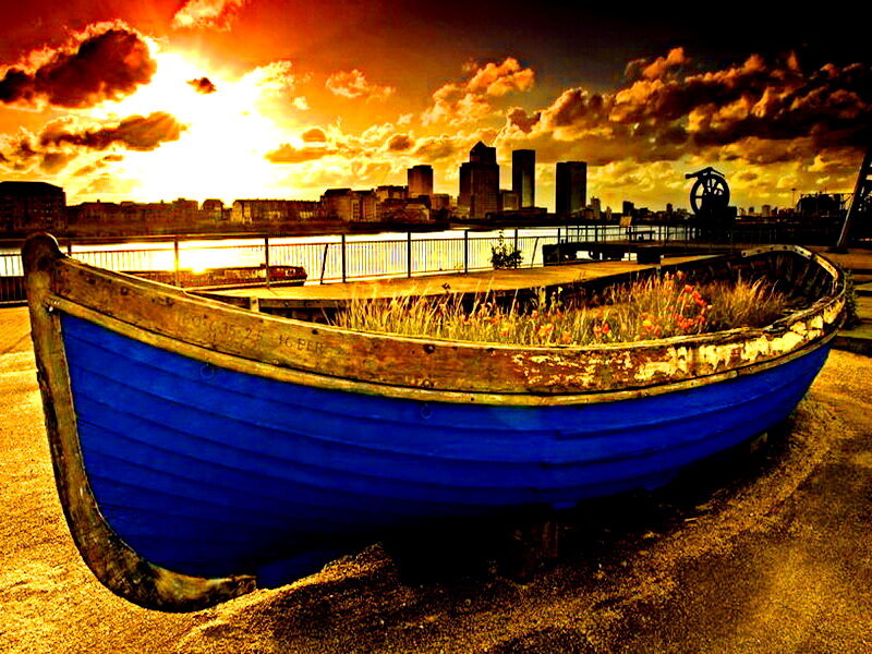 Blue Boat on Shore — Dramatic