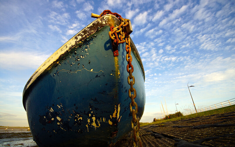 Blue Boat on Shore — Serene, Sunset, Photograph