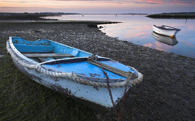Blue Boat on Shore — Serene, Sunset