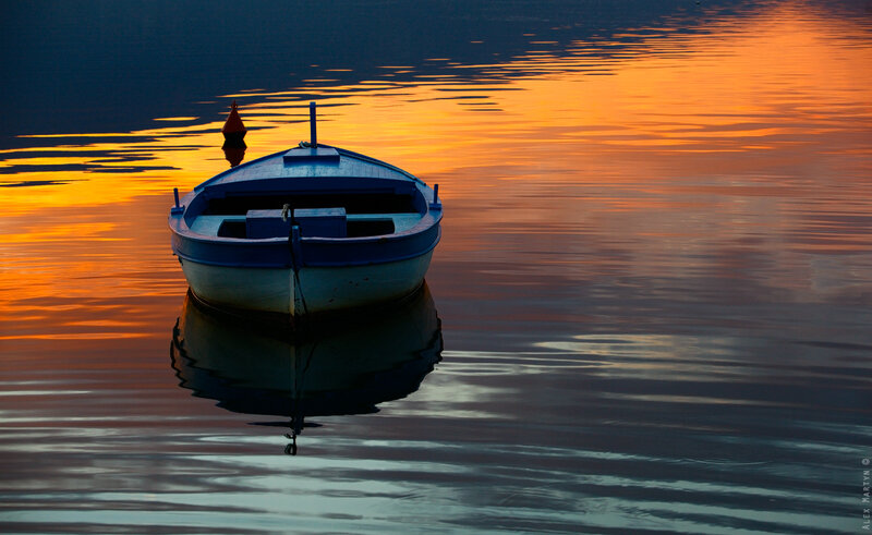 Blue Boat on Water — Orange
