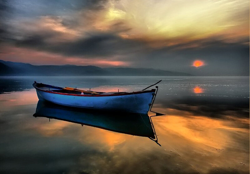 Blue Boat on Water — Serene, Sunset