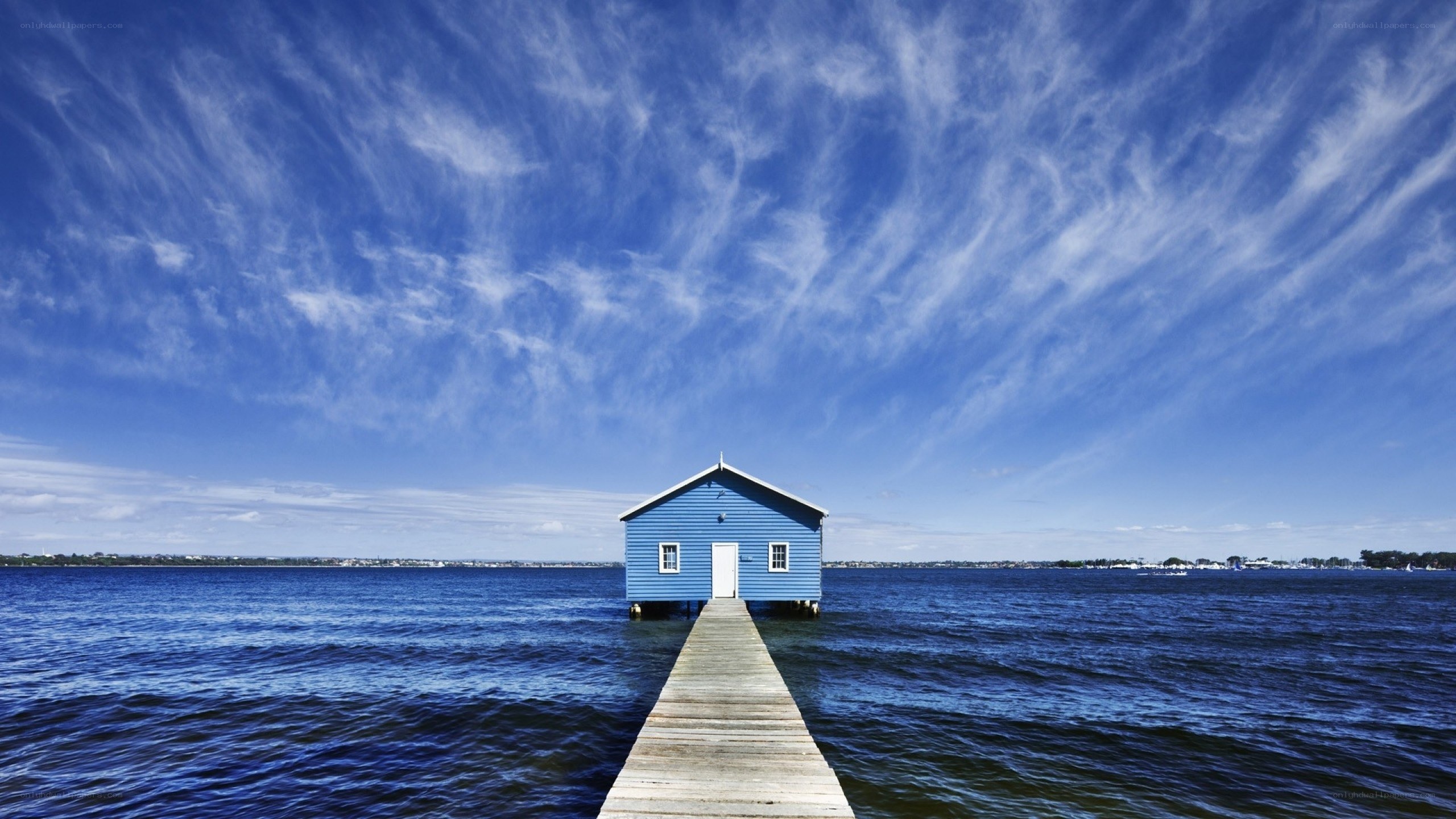 Blue boathouse on a pier