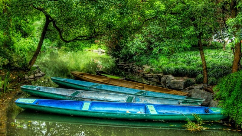 Blue boats on a calm river