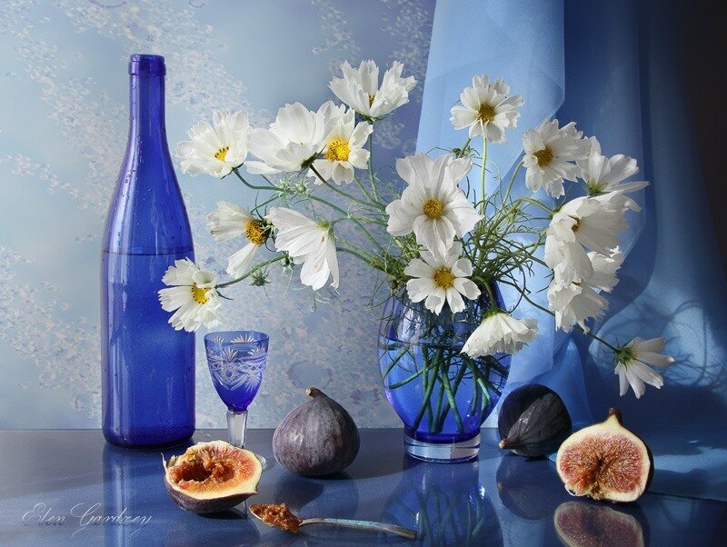 Blue bottle with white flowers