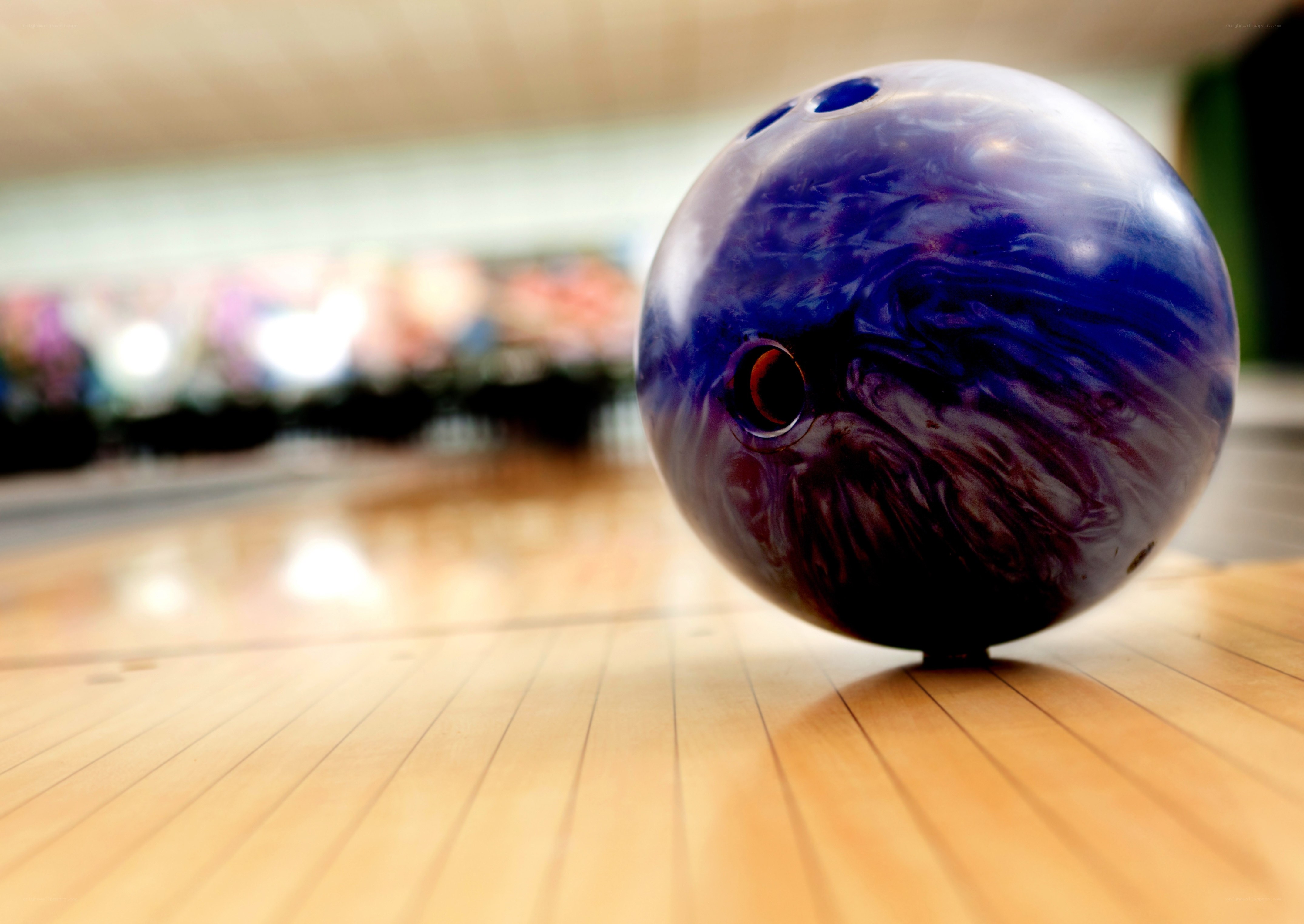 blue bowling ball on lane