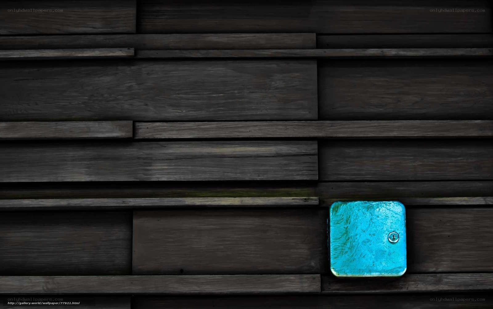 Blue box on wooden wall