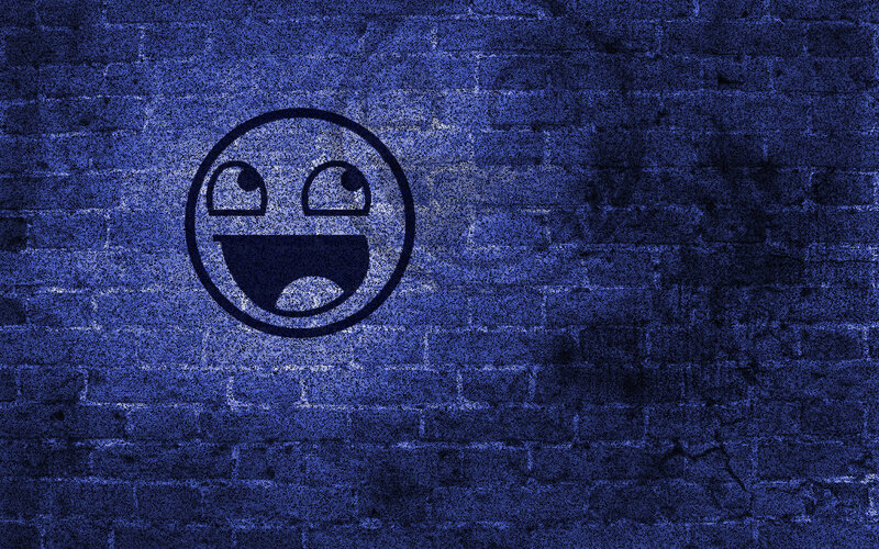 blue brick wall with smiley face